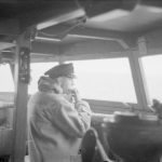 THE ROYAL NAVY DURING THE SECOND WORLD WAR (A 4330) The Captain on the bridge of HMS SUFFOLK while shadowing BISMARCK. The Captain does not leave the bridge on these occasions; here he is seen having a sandwich for his lunch. Copyright: © IWM. Original Source: http://www.iwm.org.uk/collections/item/object/205185331