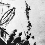 DUNKIRK 26 - 29 MAY 1940 (HU 41240) British soldiers wade out to a waiting destroyer off Dunkirk during Operation Dynamo. Copyright: © IWM. Original Source: http://www.iwm.org.uk/collections/item/object/205022146