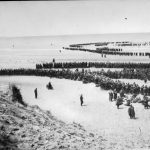 DUNKIRK 26-29 MAY 1940 (NYP 68075) British troops line up on the beach at Dunkirk to await evacuation. Copyright: © IWM. Original Source: http://www.iwm.org.uk/collections/item/object/205194324