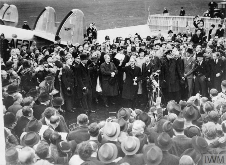 THE MUNICH AGREEMENT, SEPTEMBER 1938 (D 2239) Neville Chamberlain, the Prime Minister, makes a brief speech announcing ?'Peace in our Time'? on his arrival at Heston Airport after his meeting with Hitler at Munich, 30 September 1938. Copyright: © IWM. Original Source: http://www.iwm.org.uk/collections/item/object/205193839